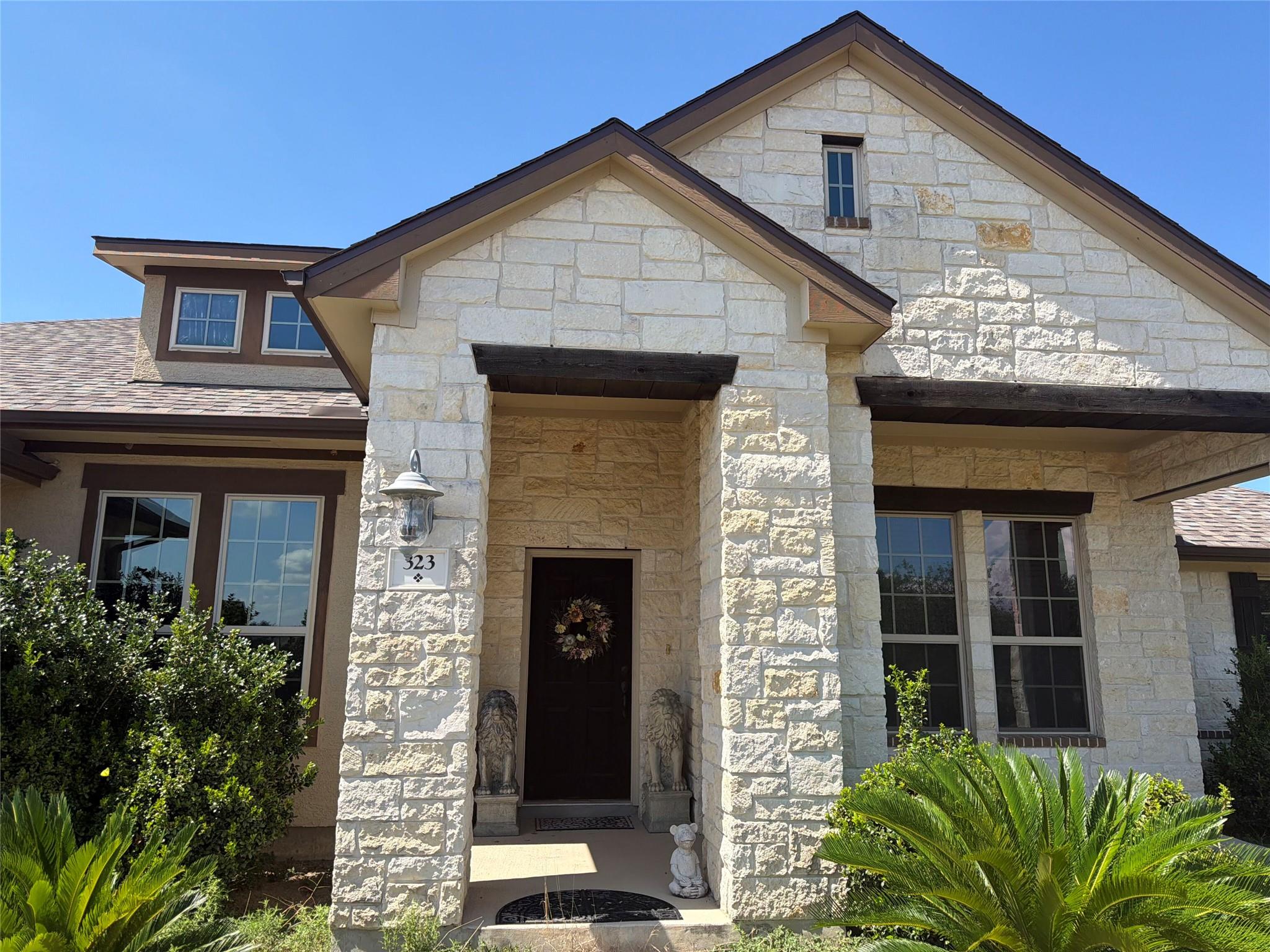 Gabled rooflines and robust stone masonry frame a