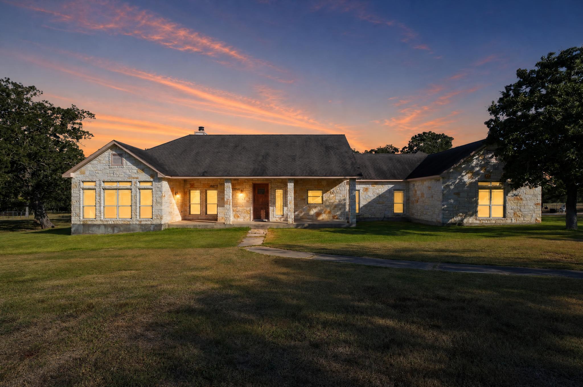 Natural stone masonry and a classic covered porch
