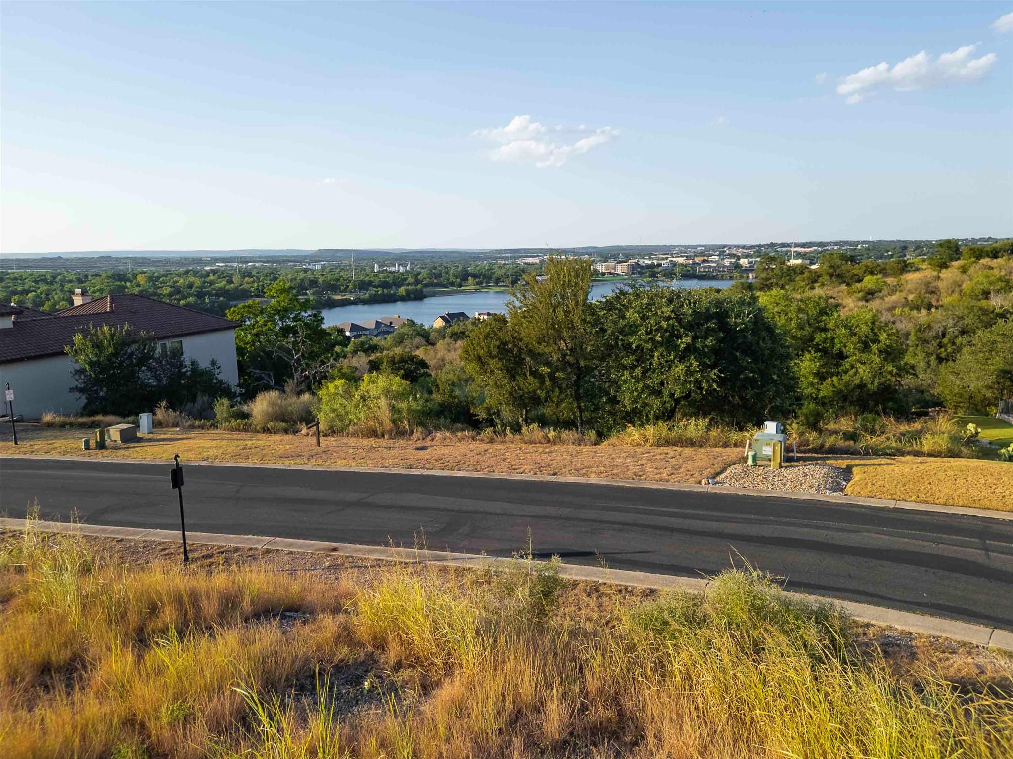 Panoramic neighborhood and water vistas await fro