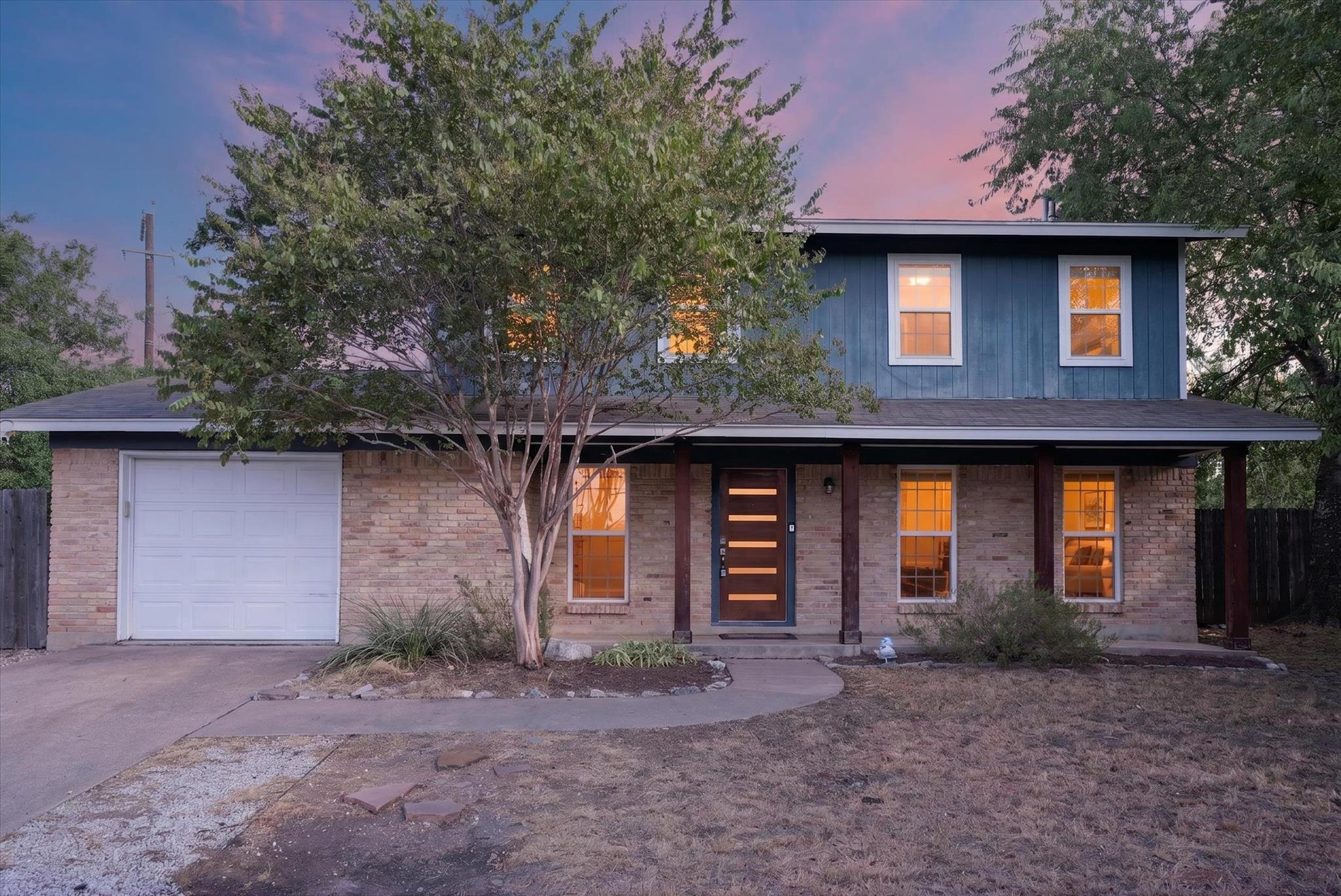 Classic brick and siding accents define the exter