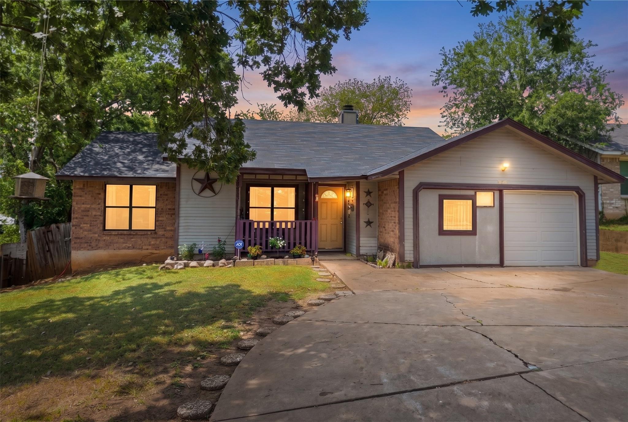 A classic ranch exterior pairs siding and brick a