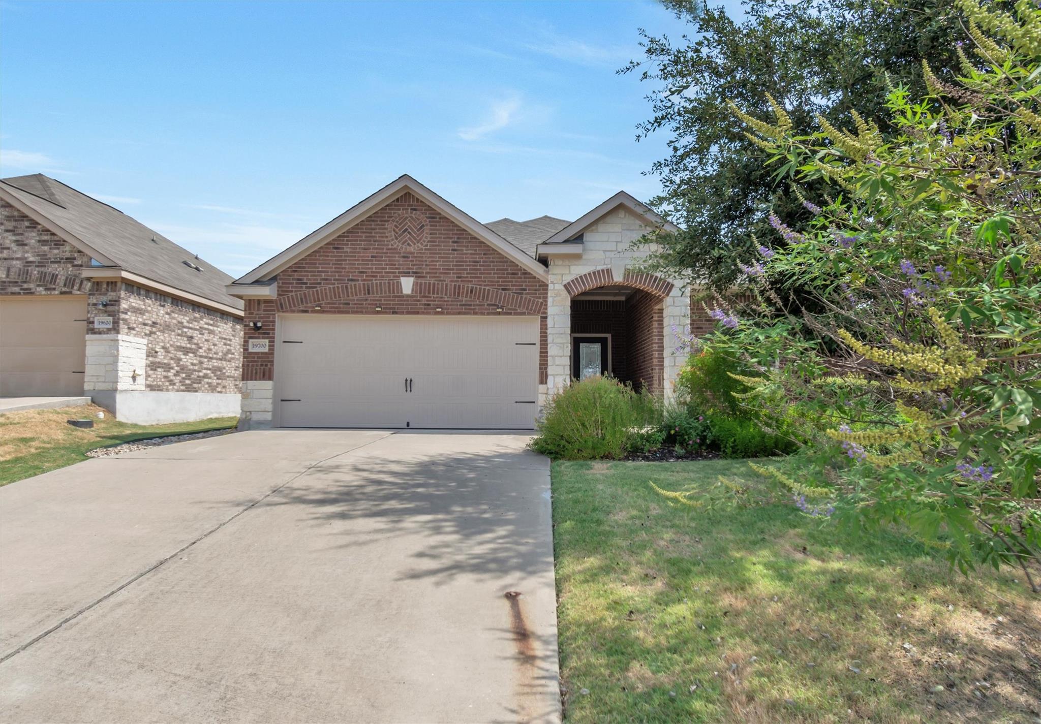 Brick and stone accents elevate the curb appeal o
