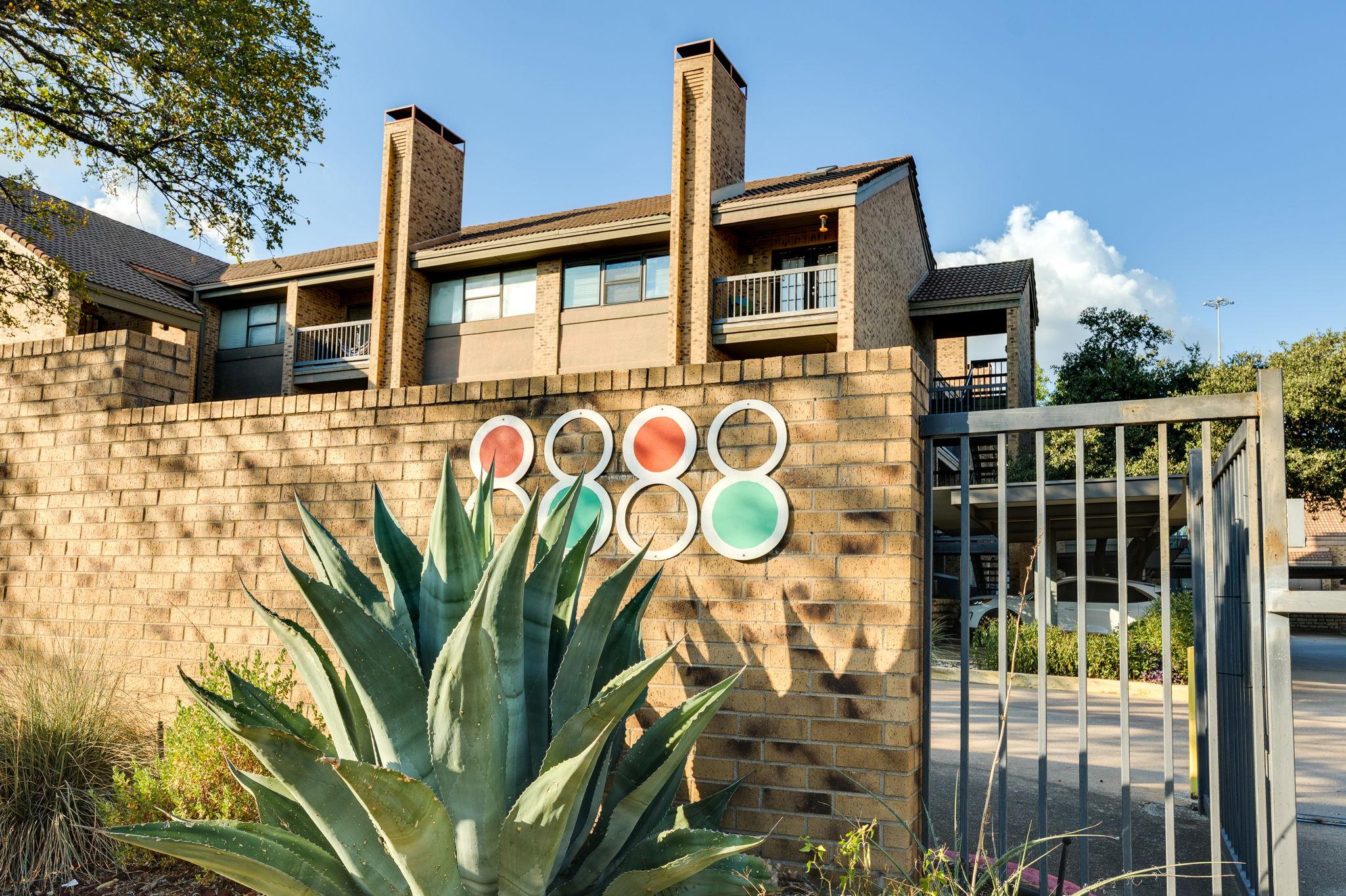 Multi-level brick architecture rises behind a sec