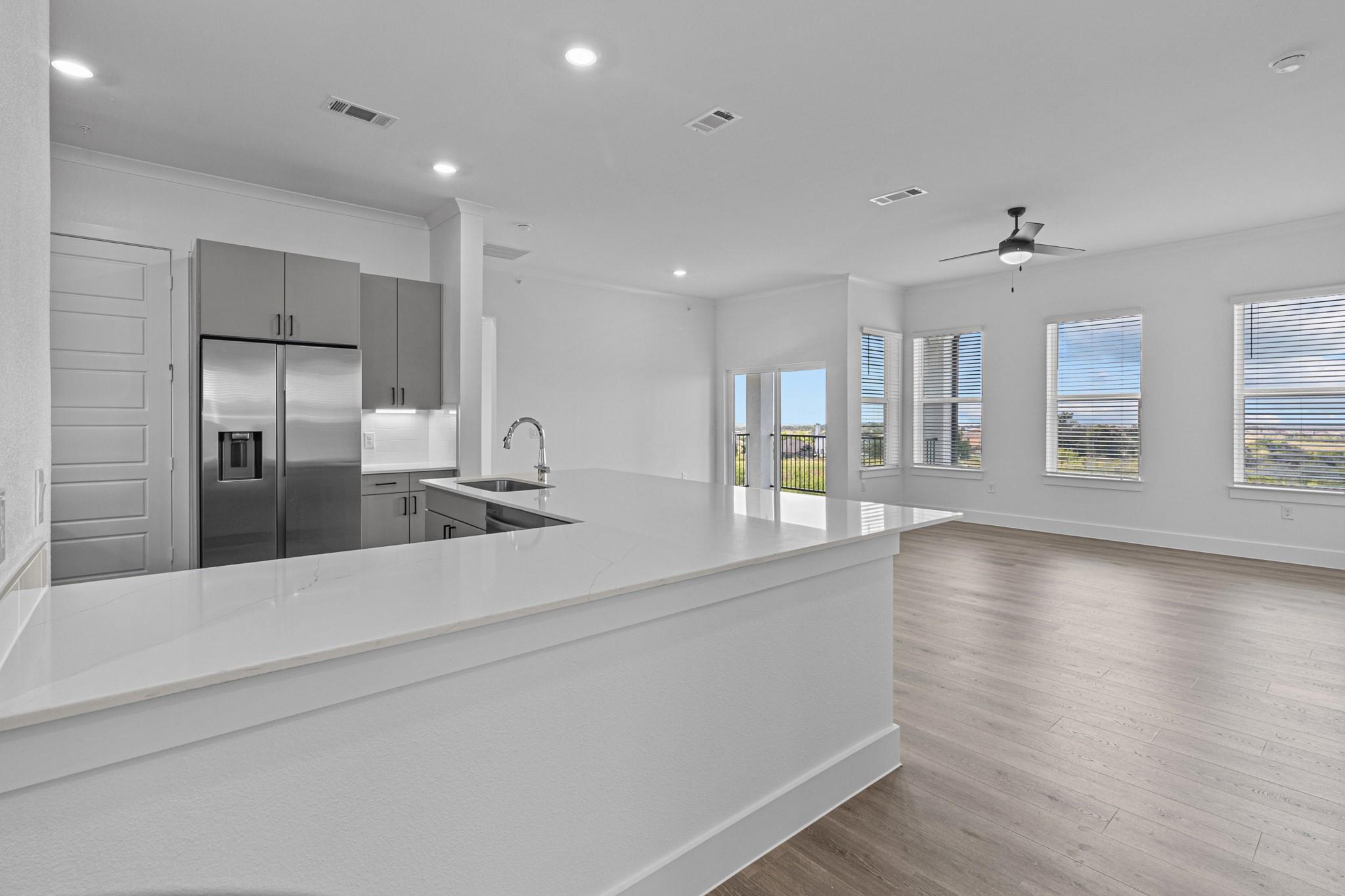 An open floor plan seamlessly connects the kitche