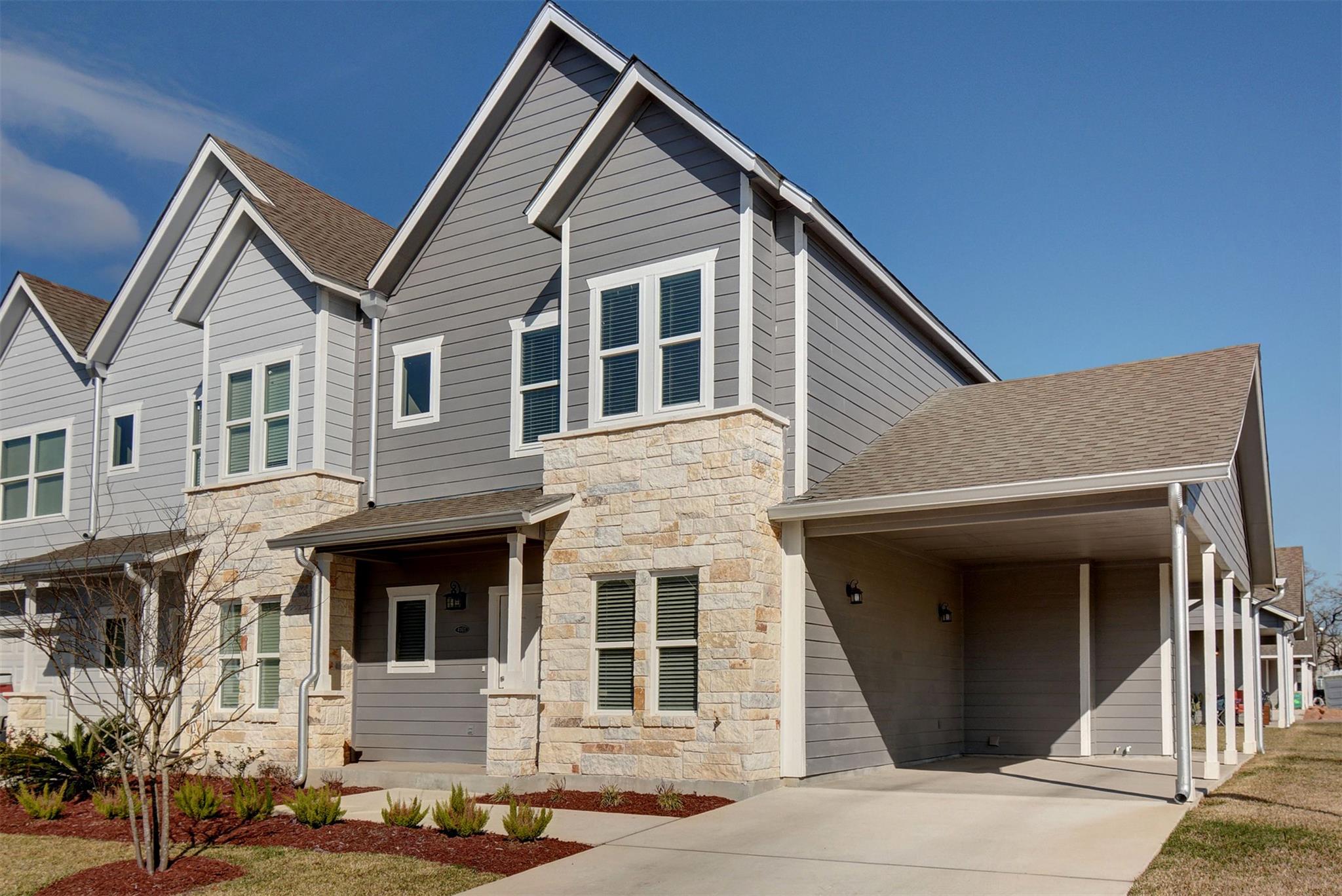 Crisp lap siding pairs beautifully with stone acc