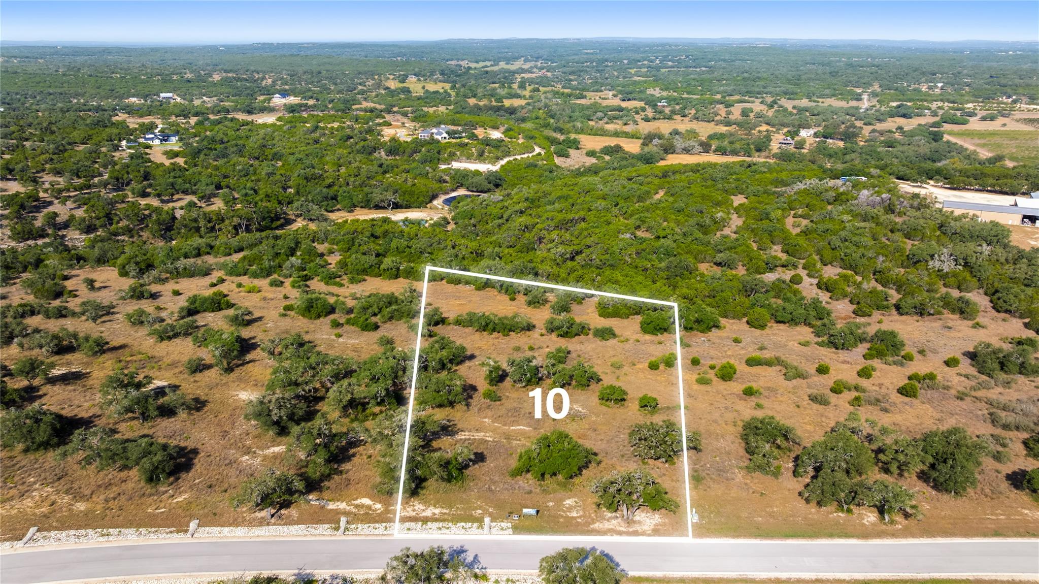 Mature trees and native vegetation cover this bea