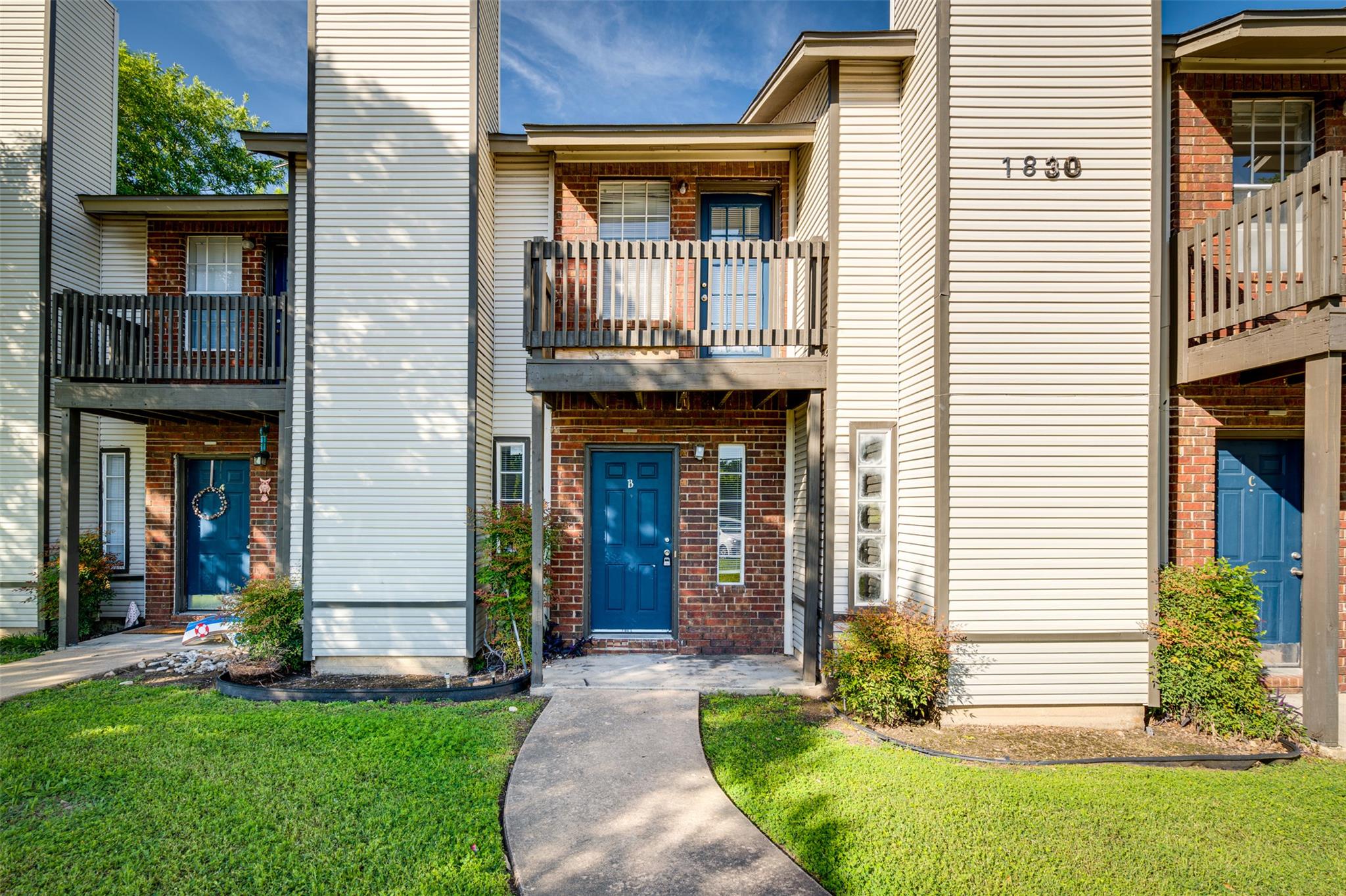 Classic brick and siding accents define this mult