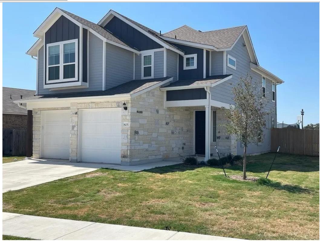 Striking stone and siding finishes define this co
