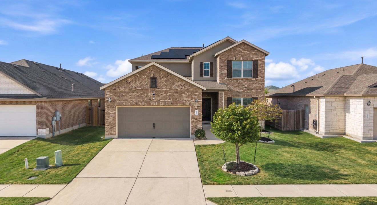 Brick and siding accents define this two-story ex