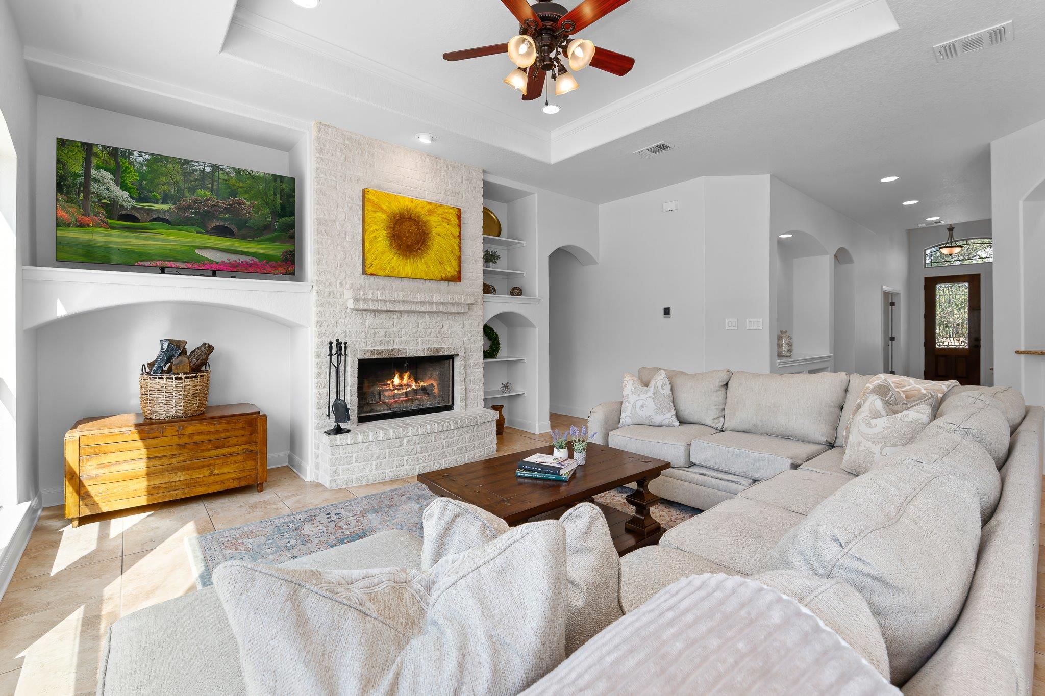 An inviting stone fireplace serves as the centerp