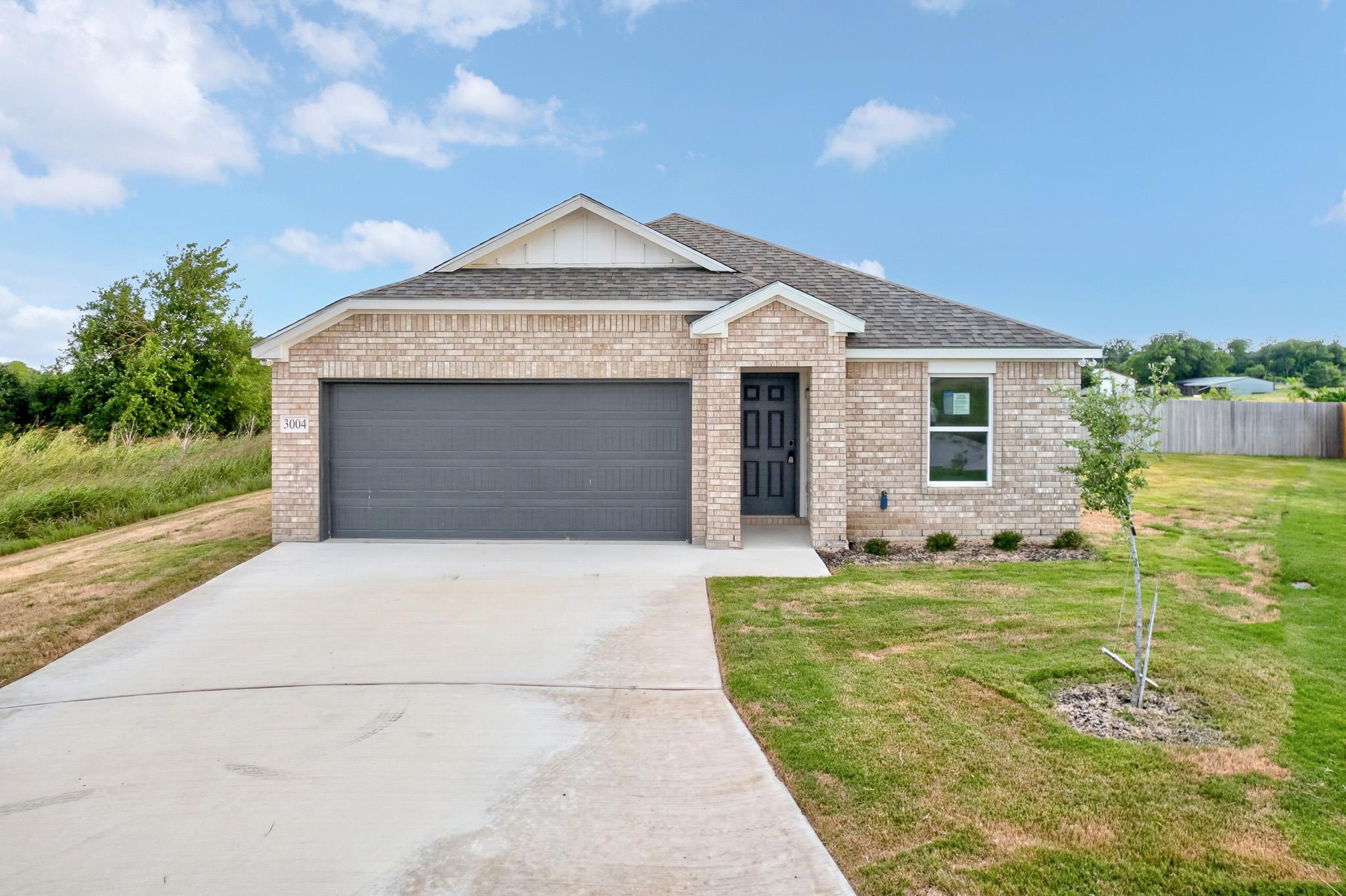 An attractive brick exterior presents a classic s
