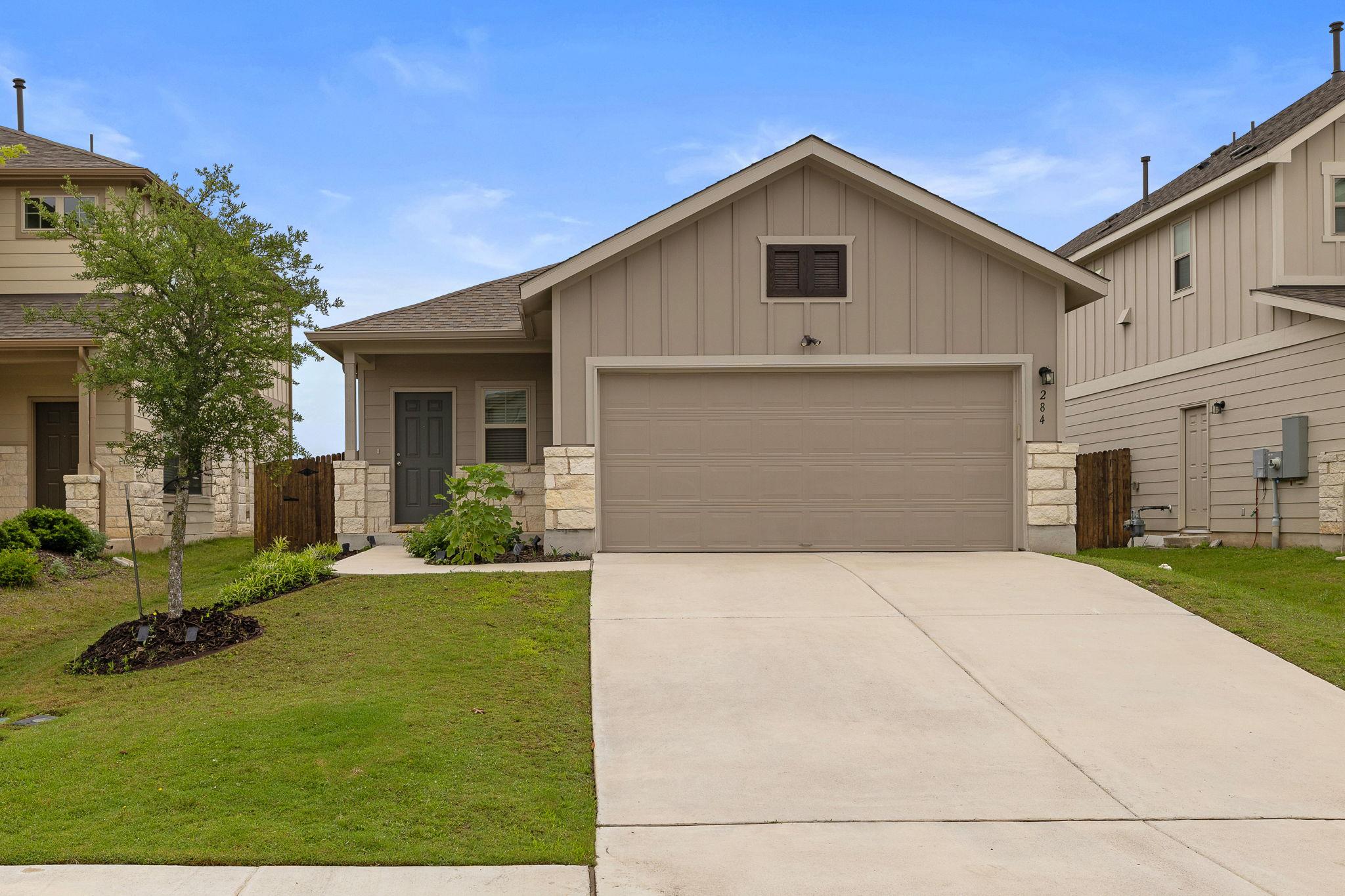 Board and batten siding pairs with stone accents 