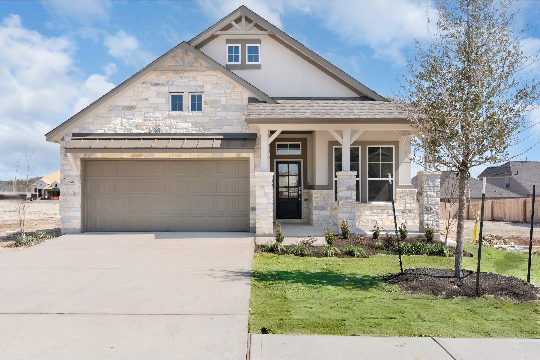 Stone accents and a covered front porch create re