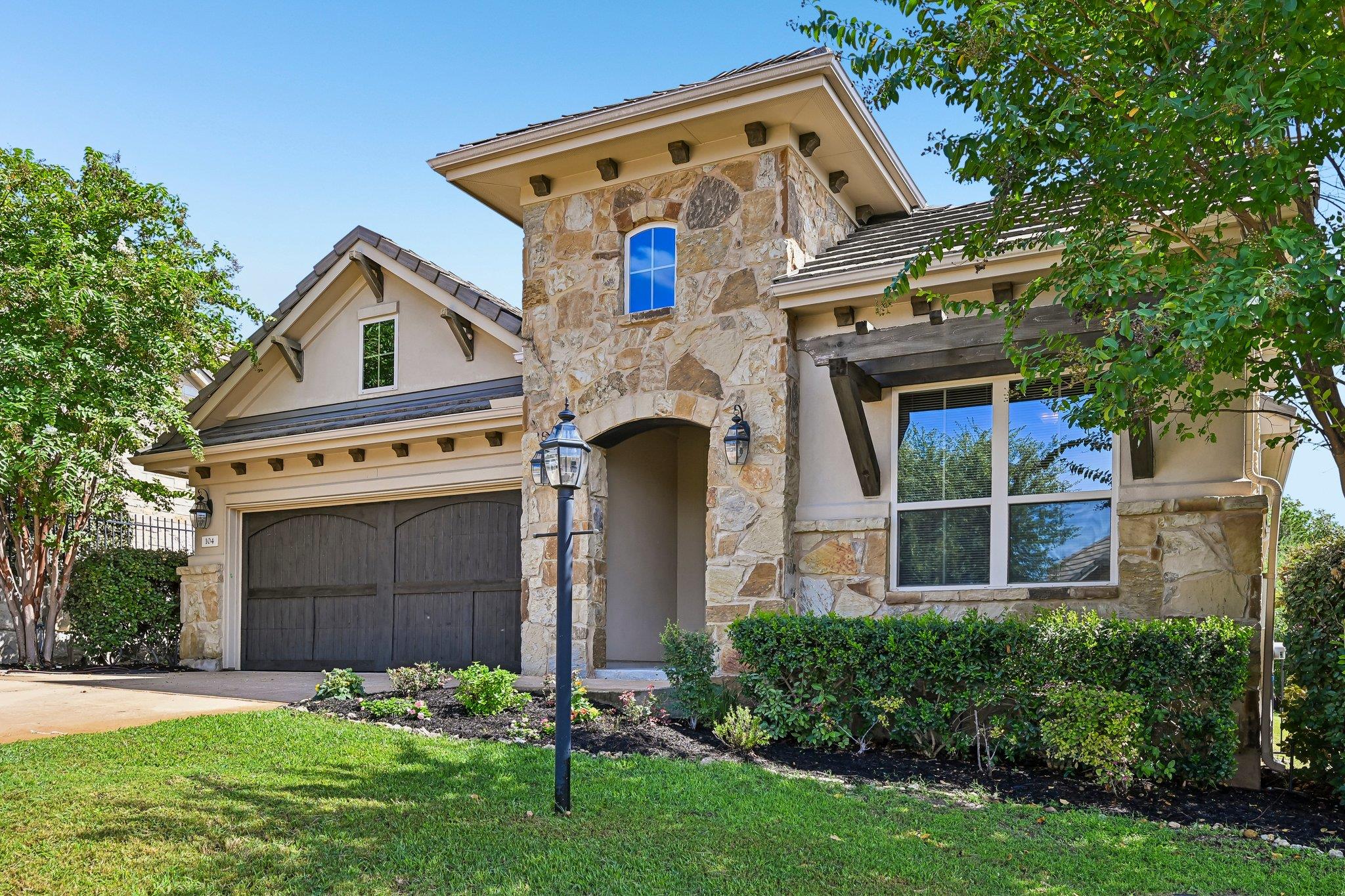 Natural stone accents and rich wood details eleva