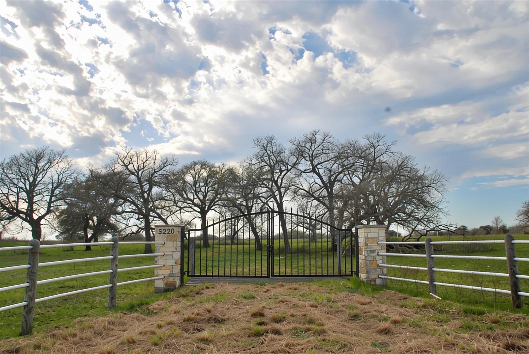 Secure gated entry frames the approach to this ex