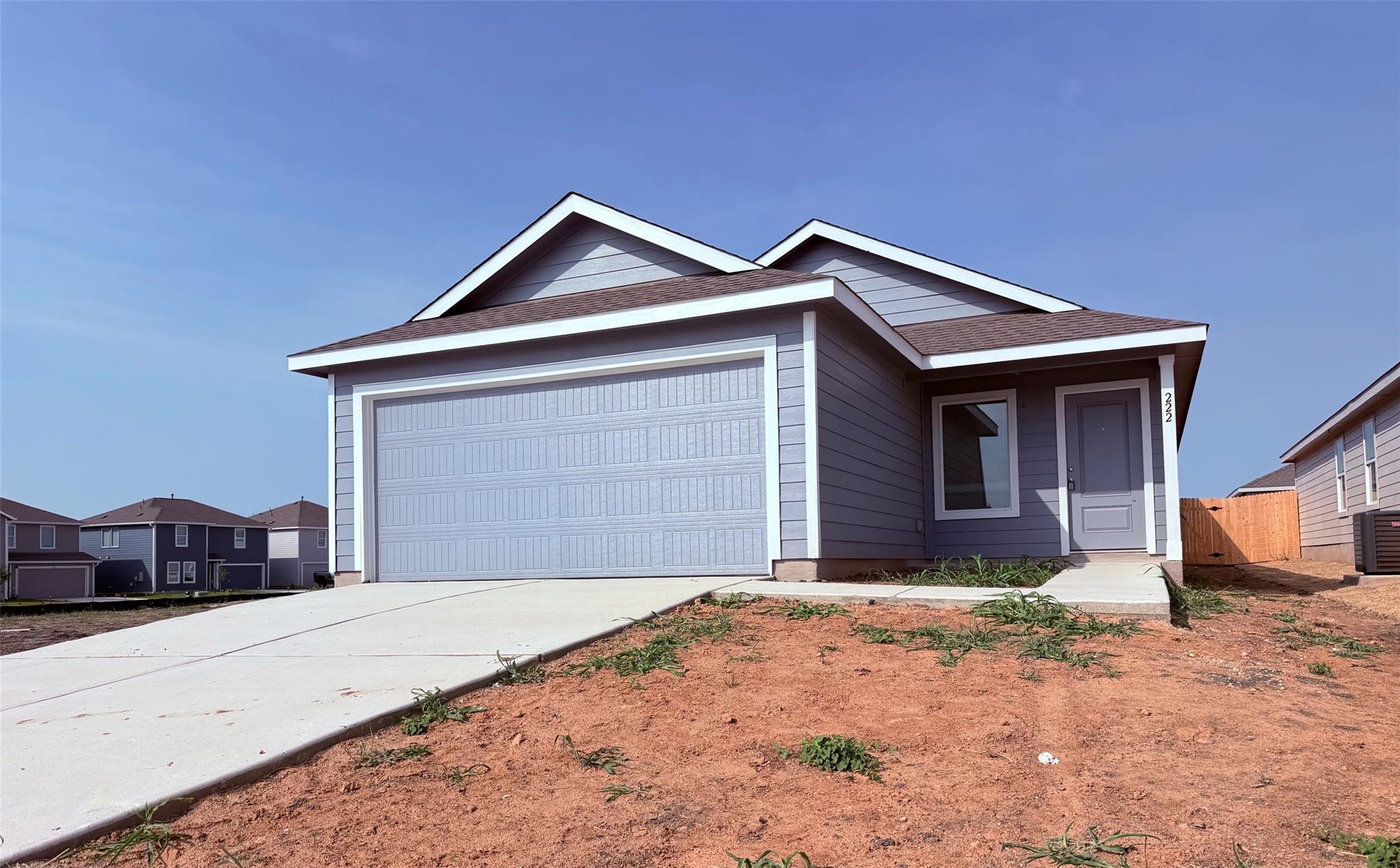 Clean lines and a spacious driveway define this m