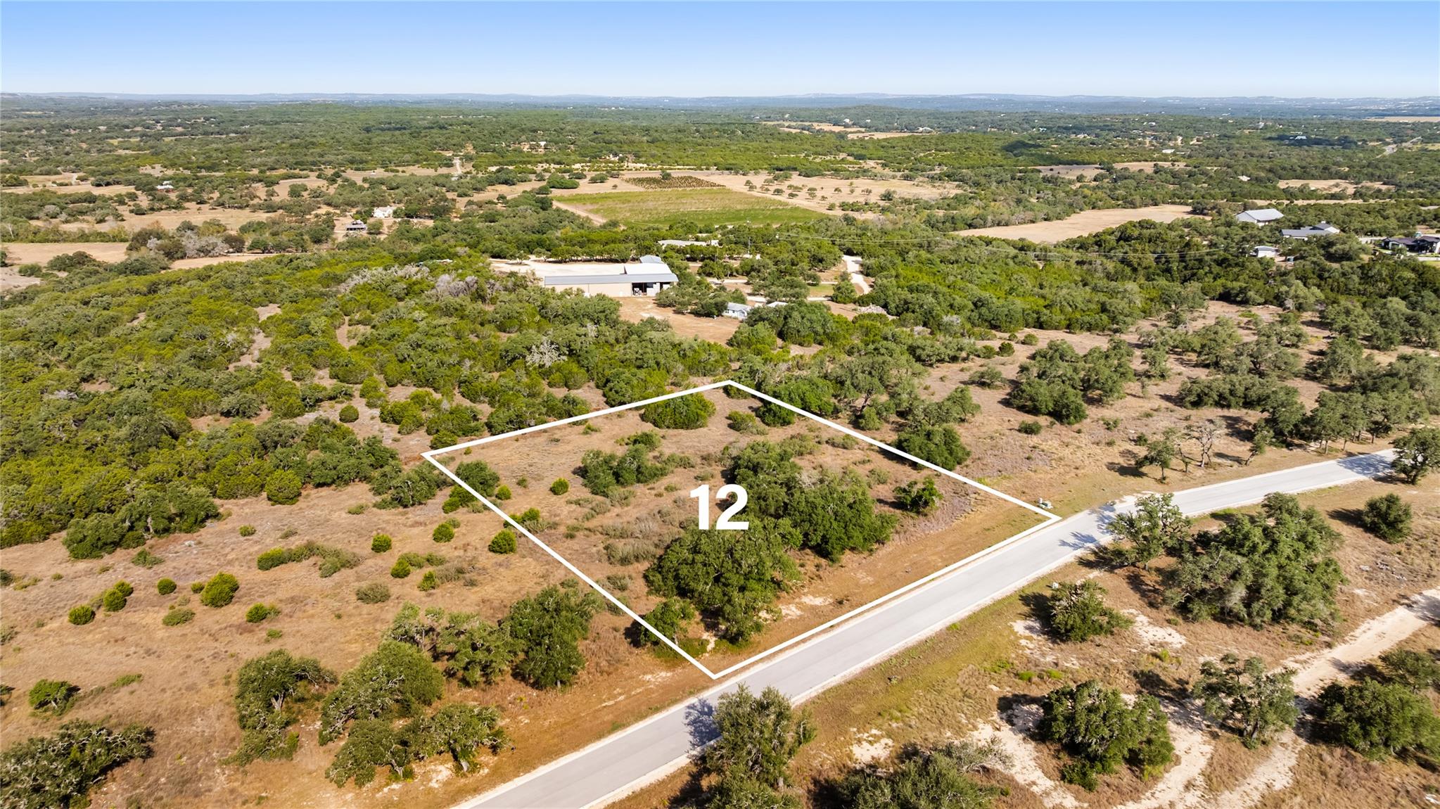 An aerial perspective showcases a rolling country