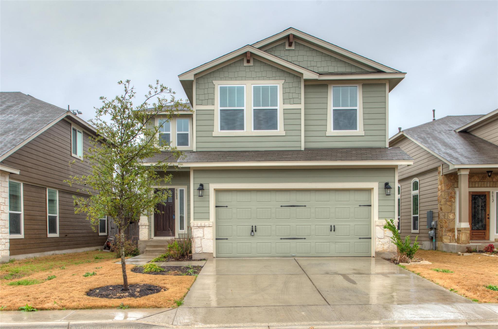 A classic two-story exterior showcases detailed s