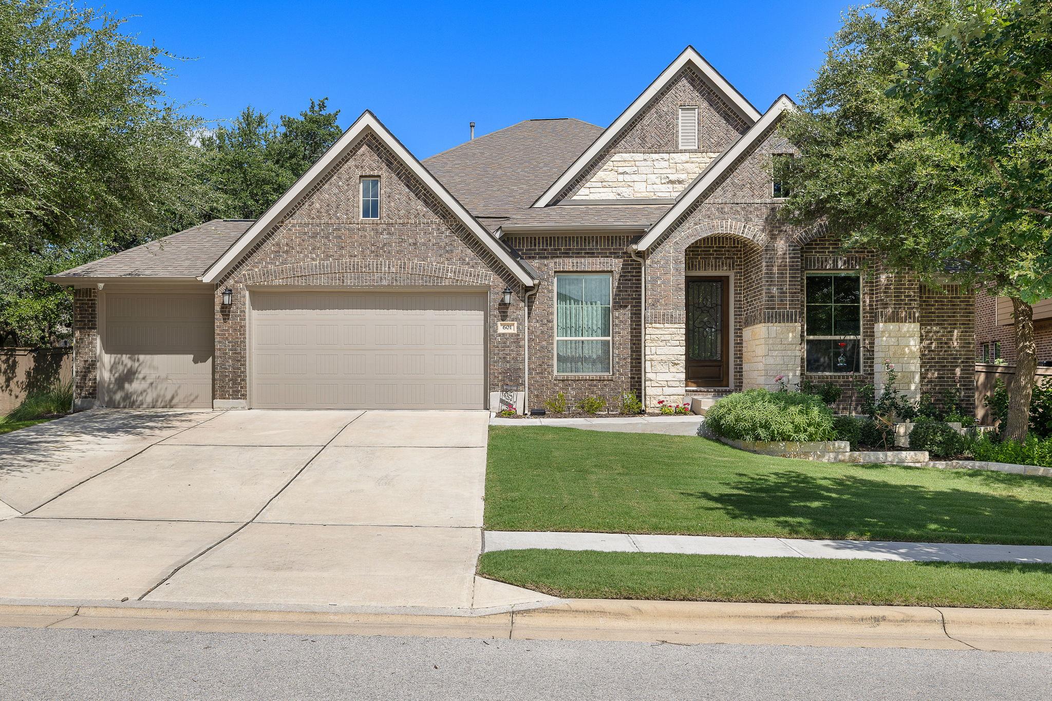 An elegant brick facade pairs with a neat front l