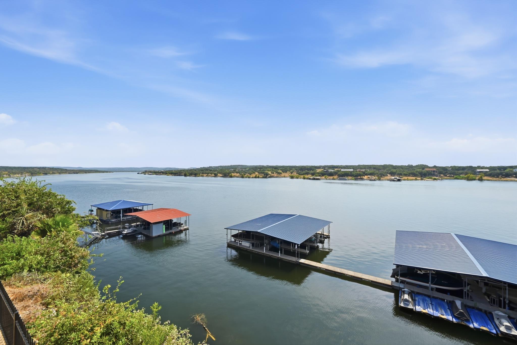 Several private covered boat slips line the calm 