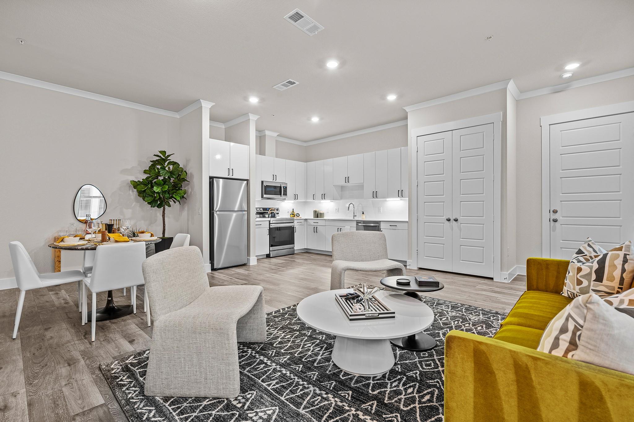 An open living space transitions into a modern ki
