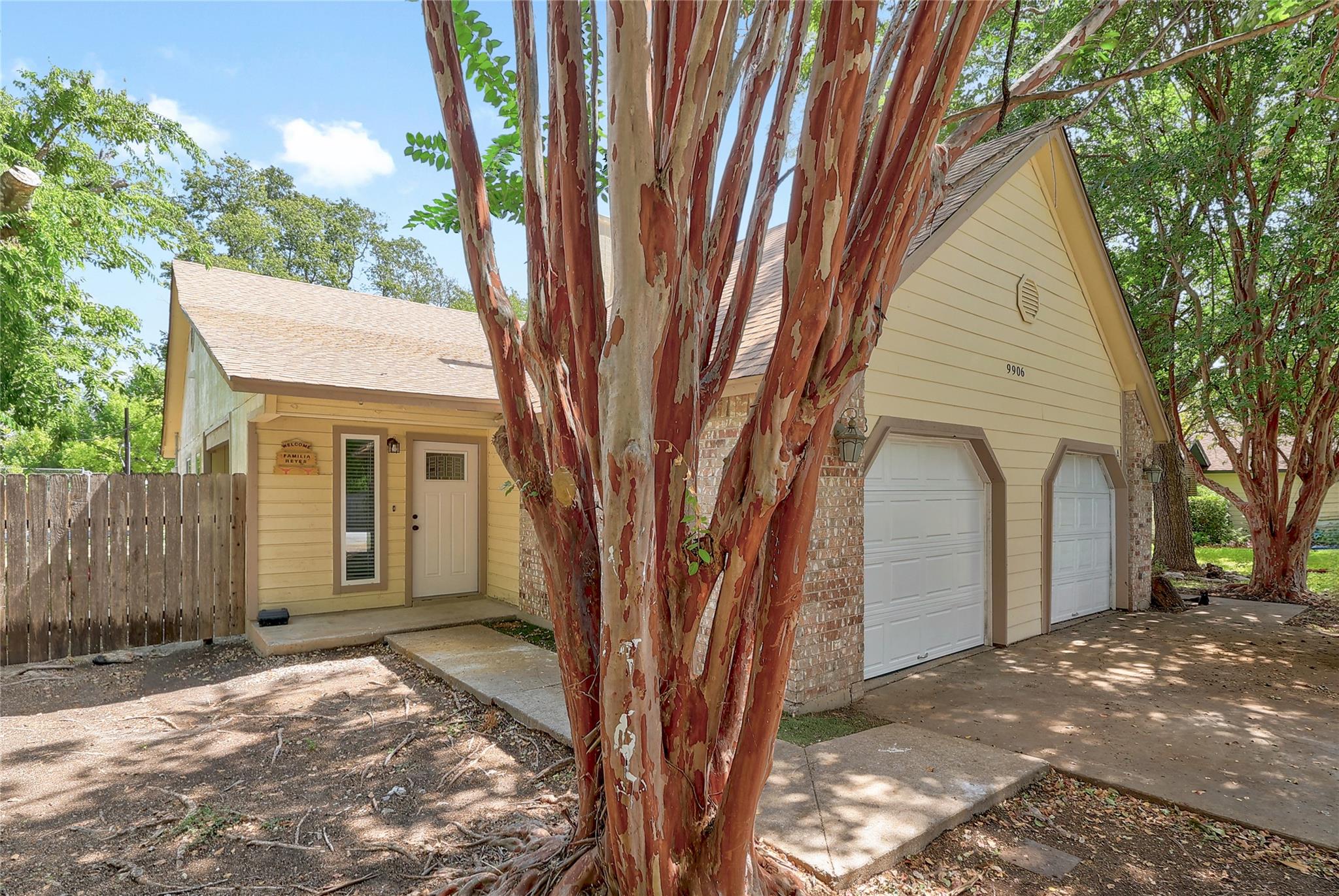 A charming exterior displays classic siding, bric