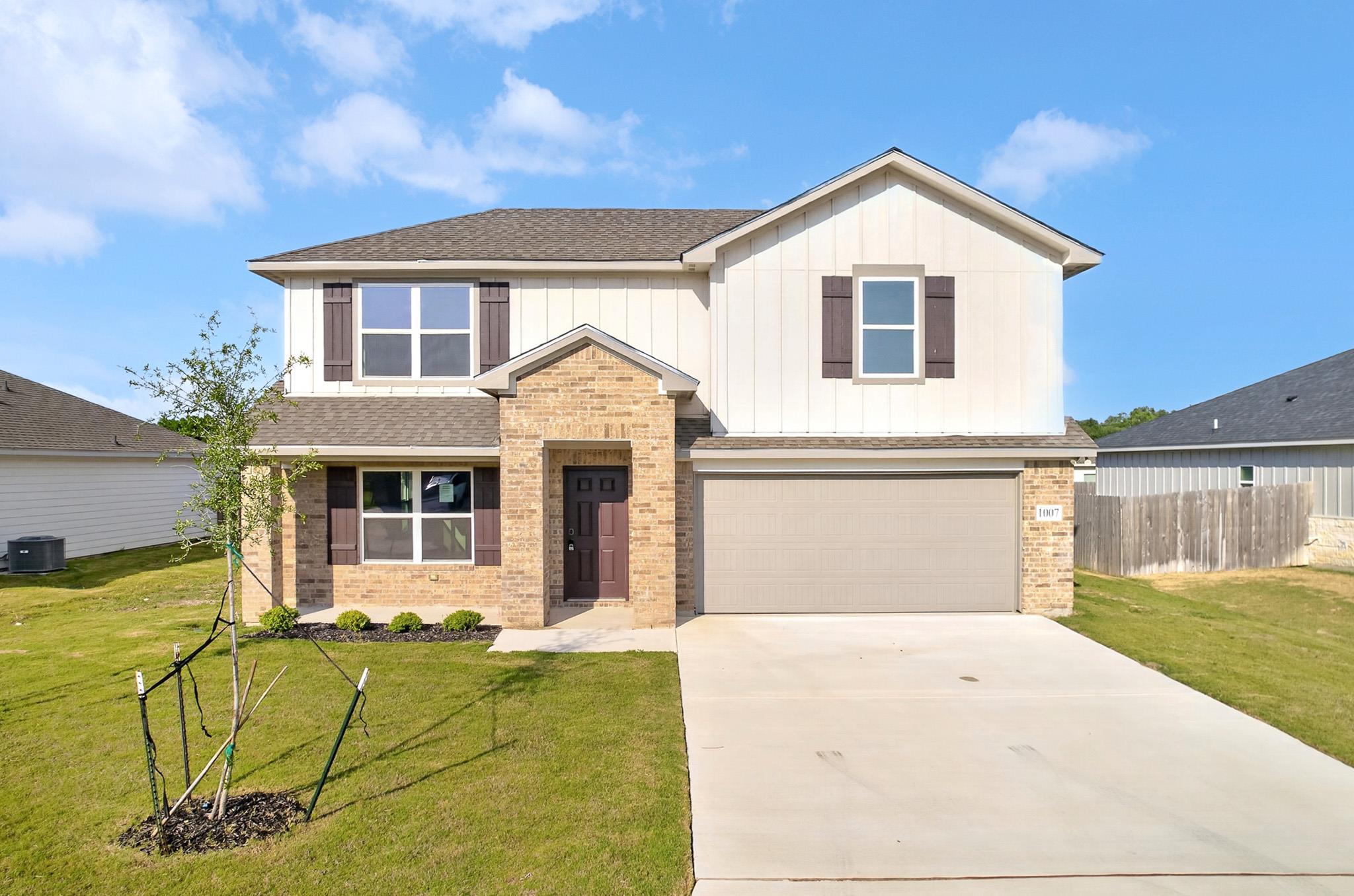 Board and batten siding pairs with classic brickw
