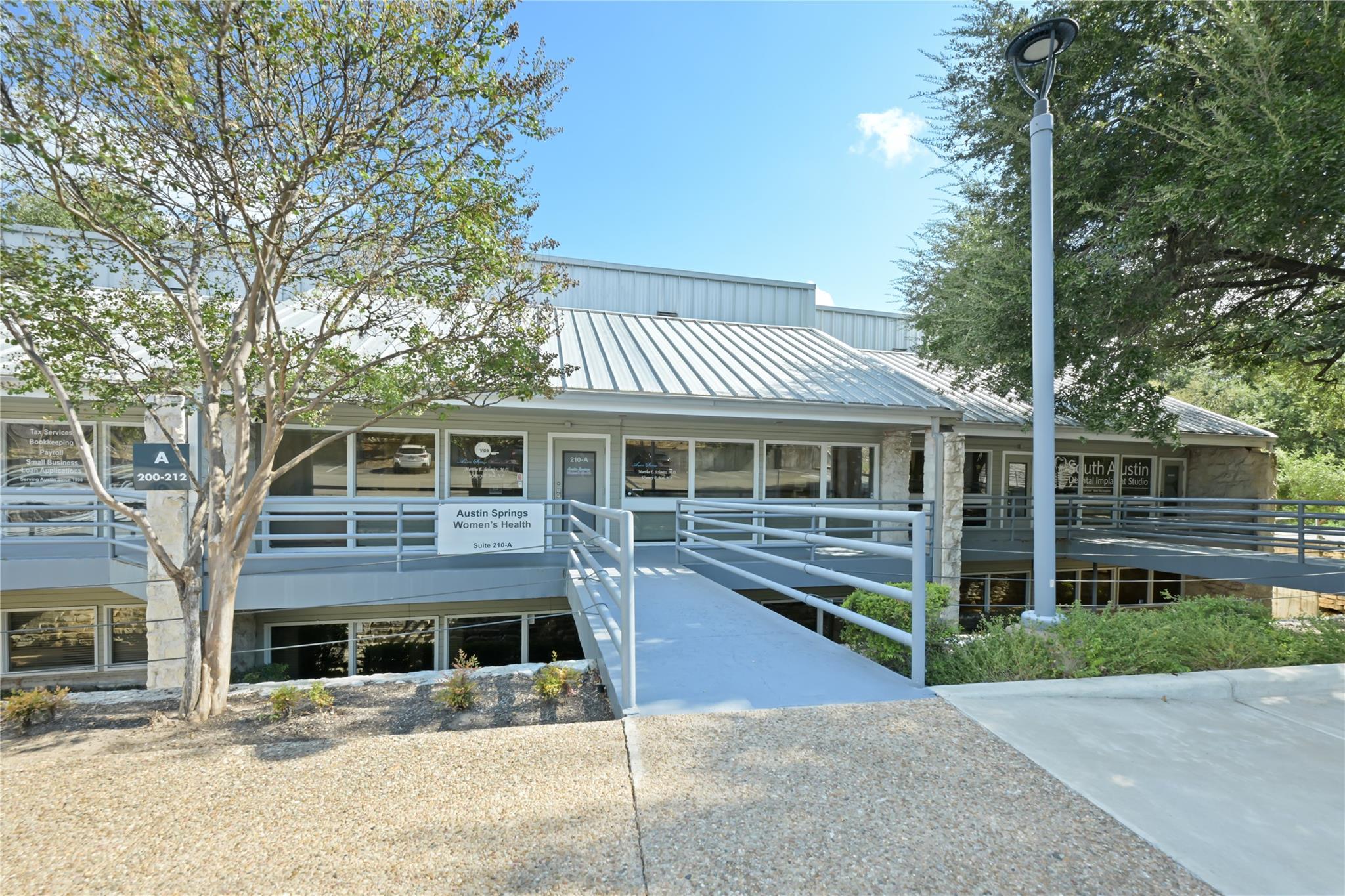 Metal roofing and stone accents define this moder