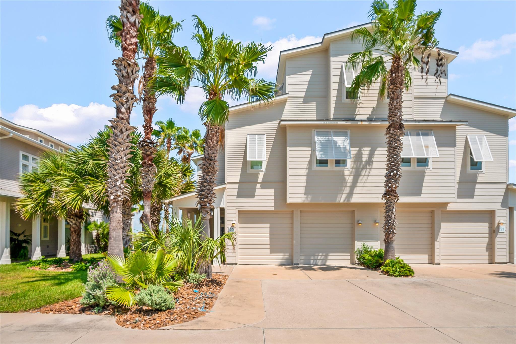 Towering palm trees frame the modern horizontal s