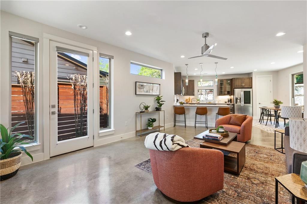 Polished concrete flooring pairs with tall glass 