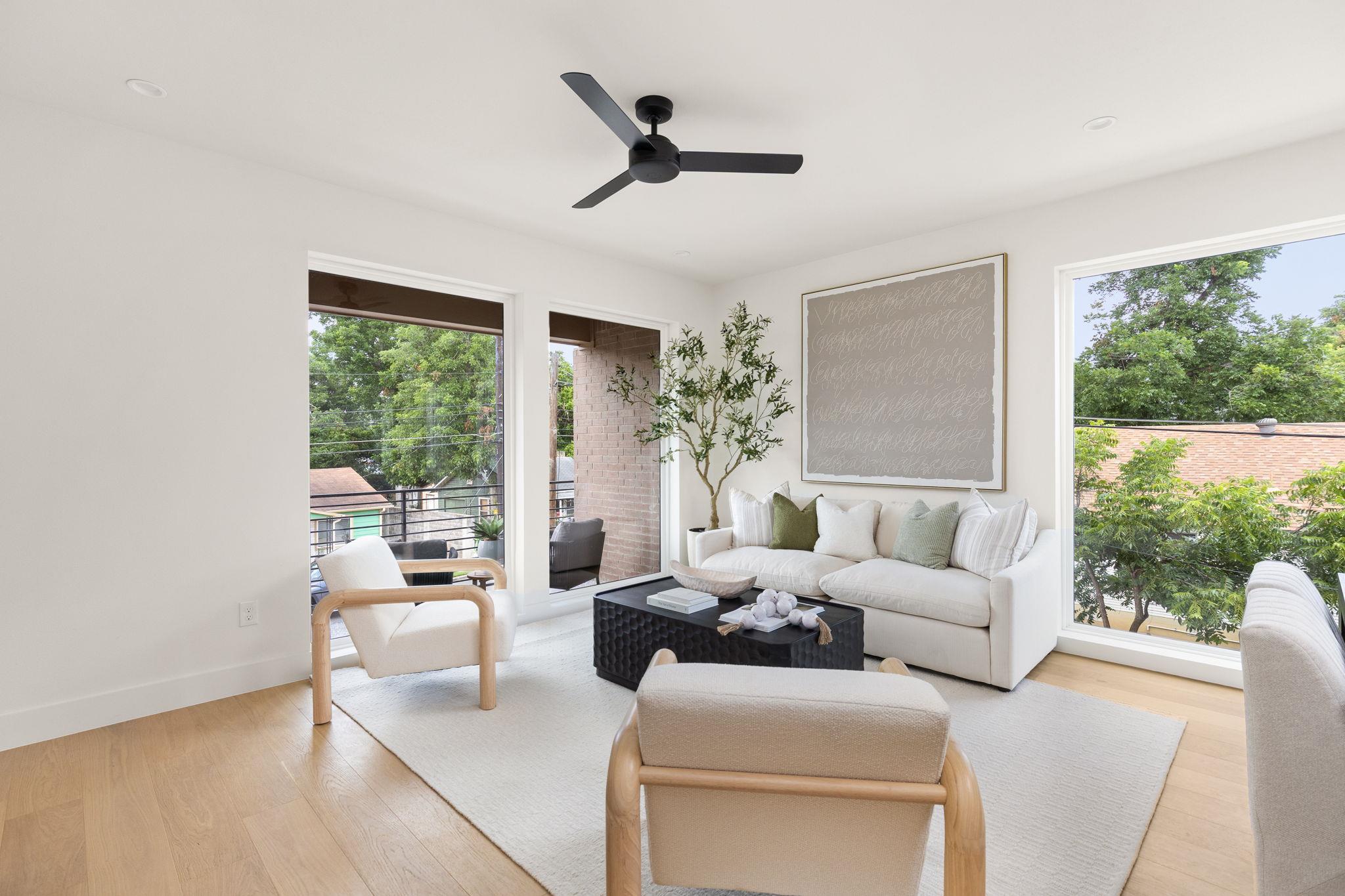 Natural light floods this airy living space finis