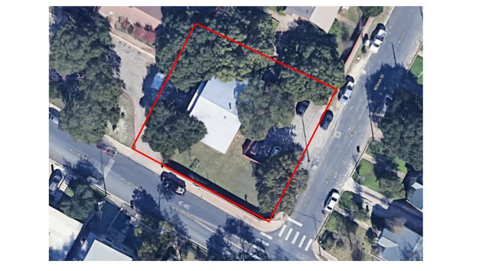 Mature trees shade a spacious corner lot defined 