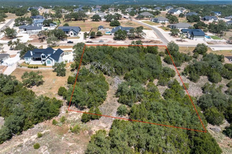 Mature trees blanket this expansive residential l