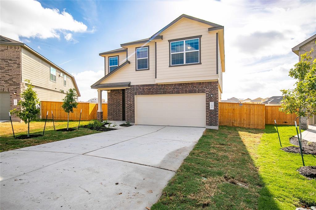 A spacious concrete driveway leads to the integra