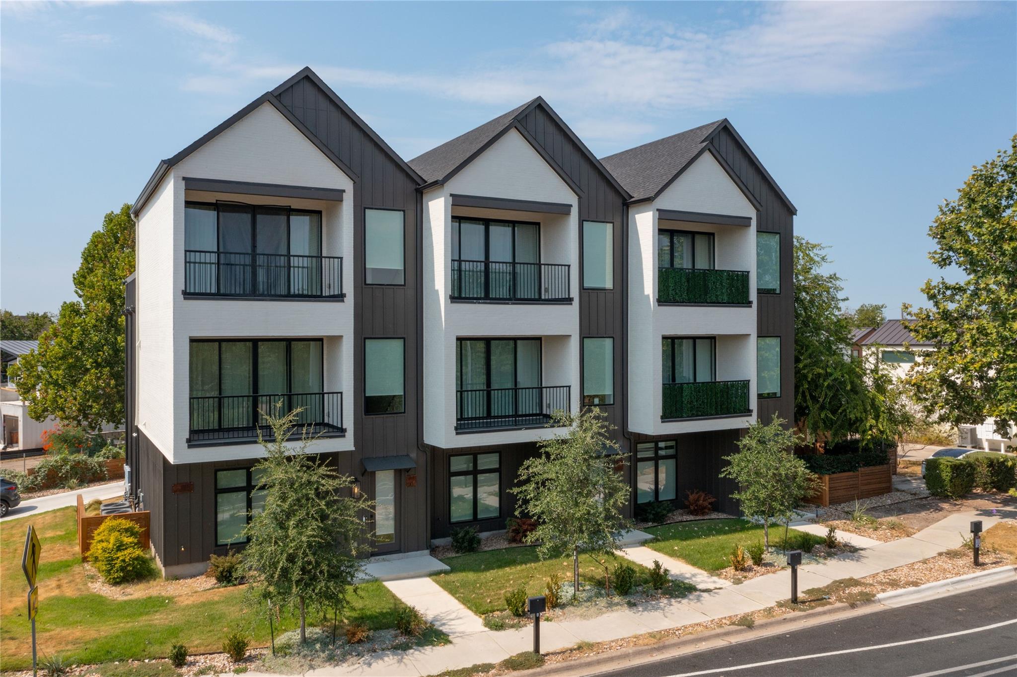 Bold gables and modern vertical siding create str
