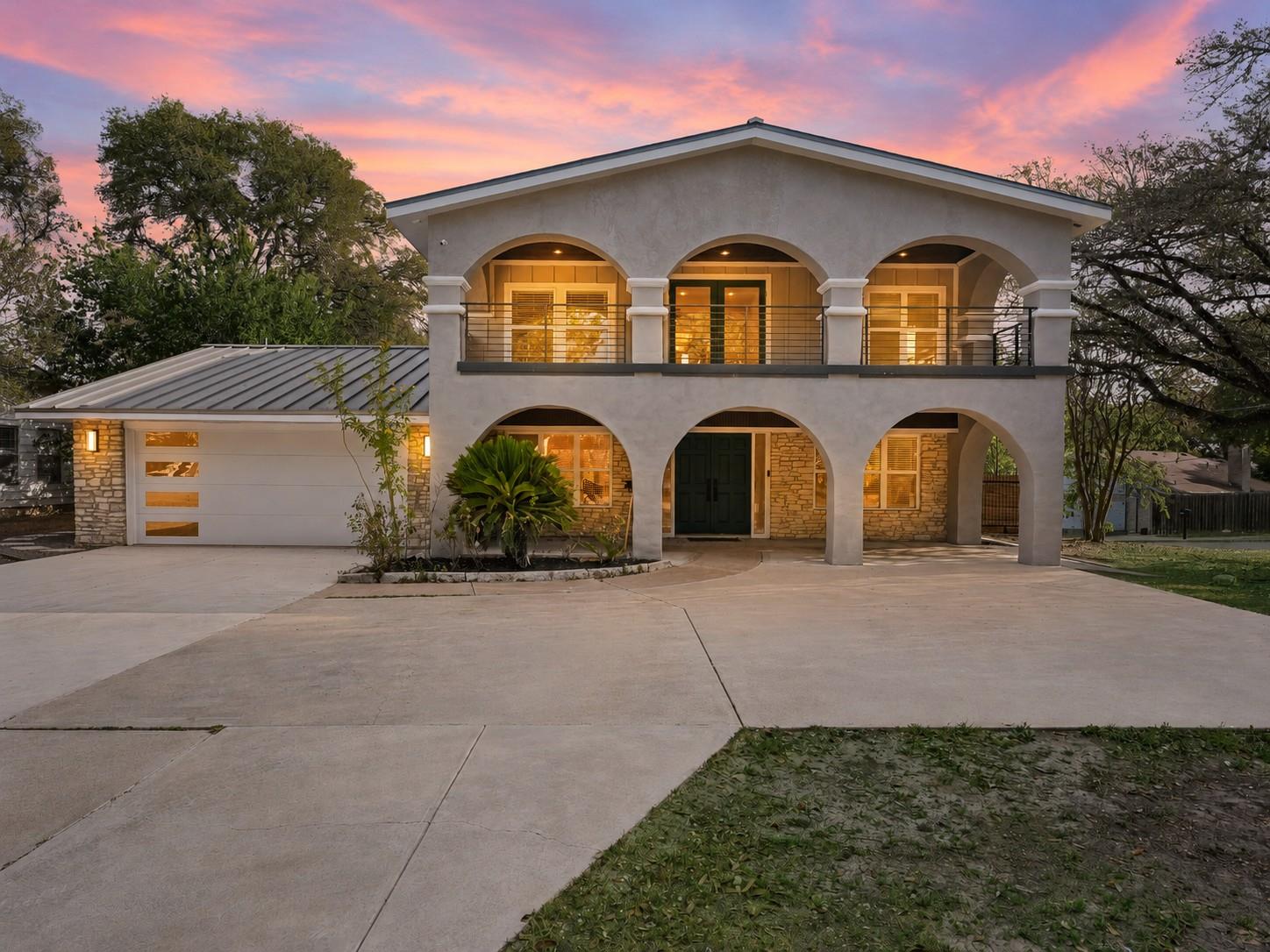 Striking architectural arches frame the front fac