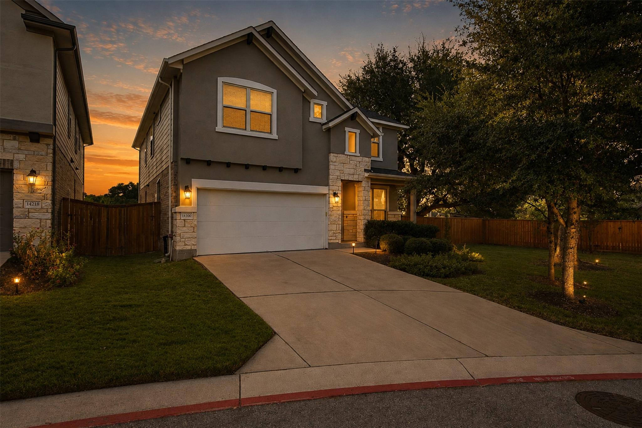 An inviting exterior balances classic stone accen