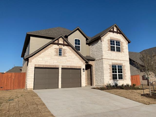An elegant stone and siding facade defines this s