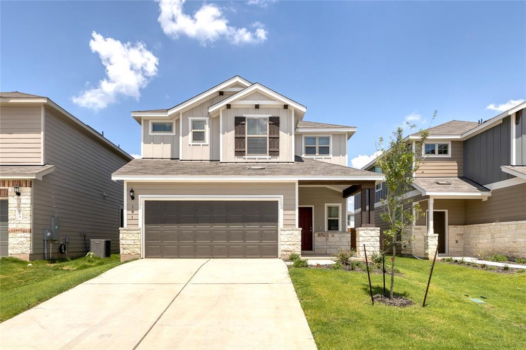 An inviting exterior balances classic masonry acc