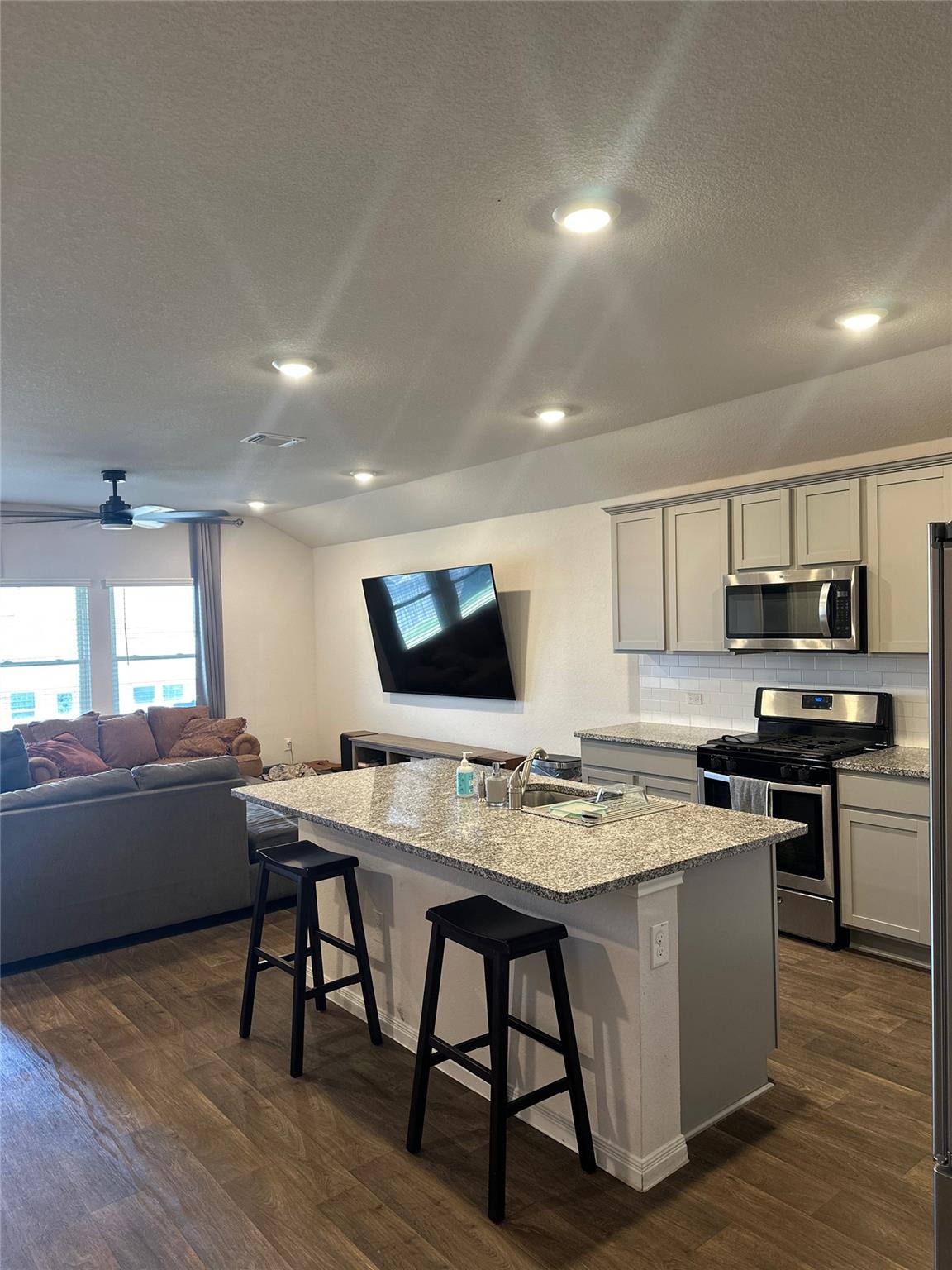 Granite countertops and recessed lighting define 