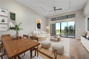 A spacious open-concept interior featuring warm w
