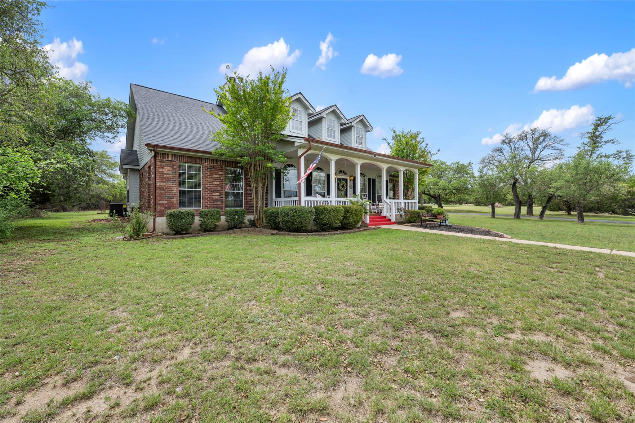 Classic brick accents and a welcoming front porch