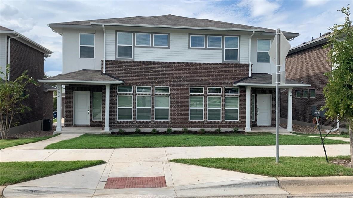 Contemporary duplex with brick and siding exterio