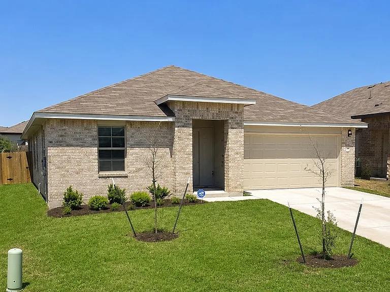 Brick cladding and a neutral roof define this mod