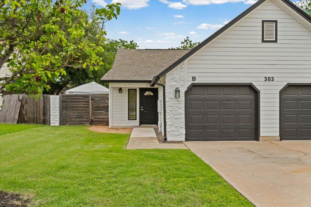 Crisp horizontal siding and textured stone accent