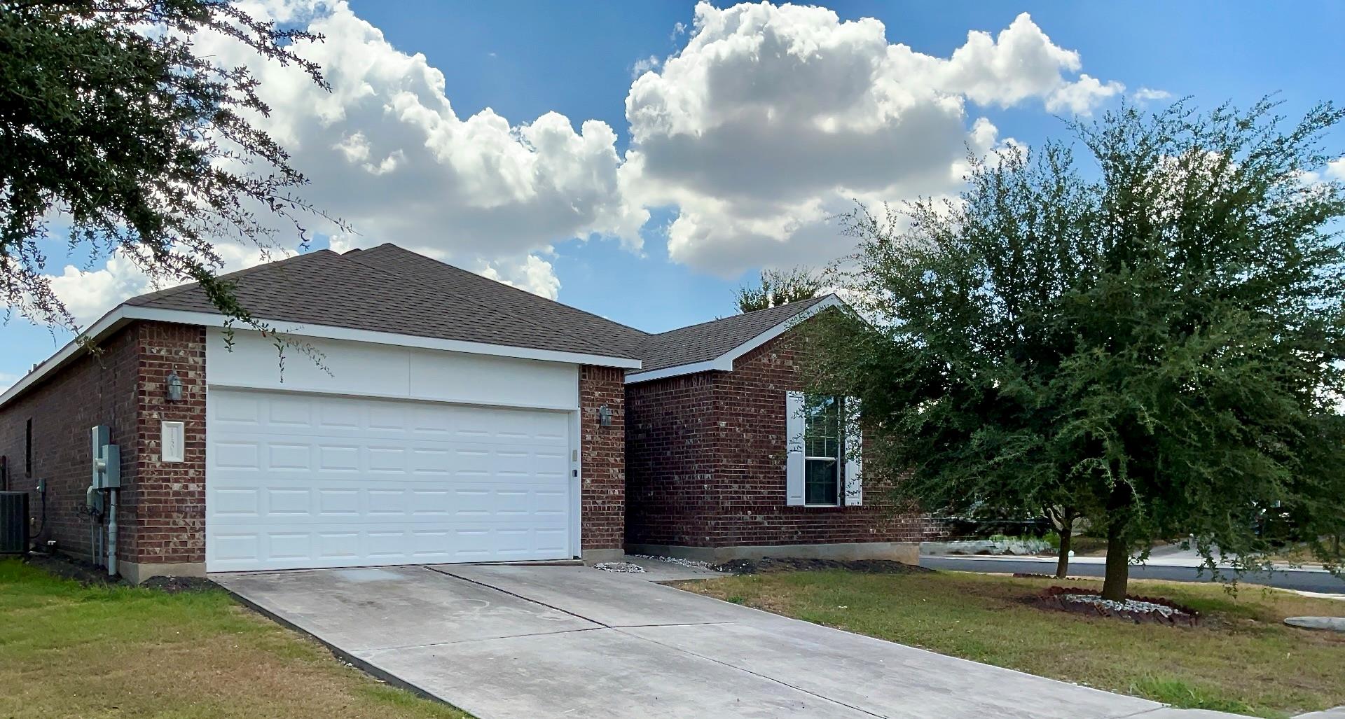 Classic brick exterior accents a single-story hom