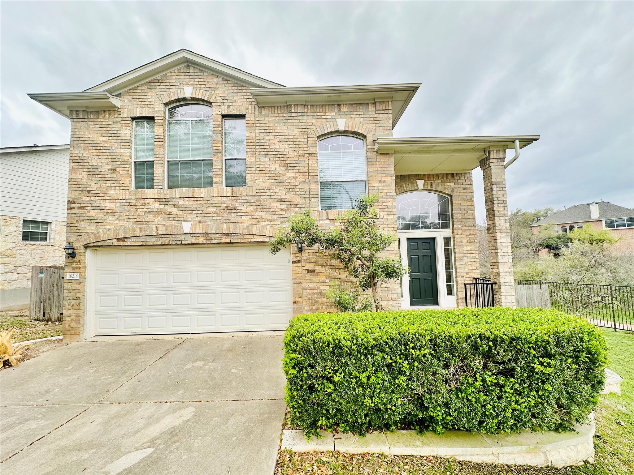 Multi-pane arched windows punctuate the classic b