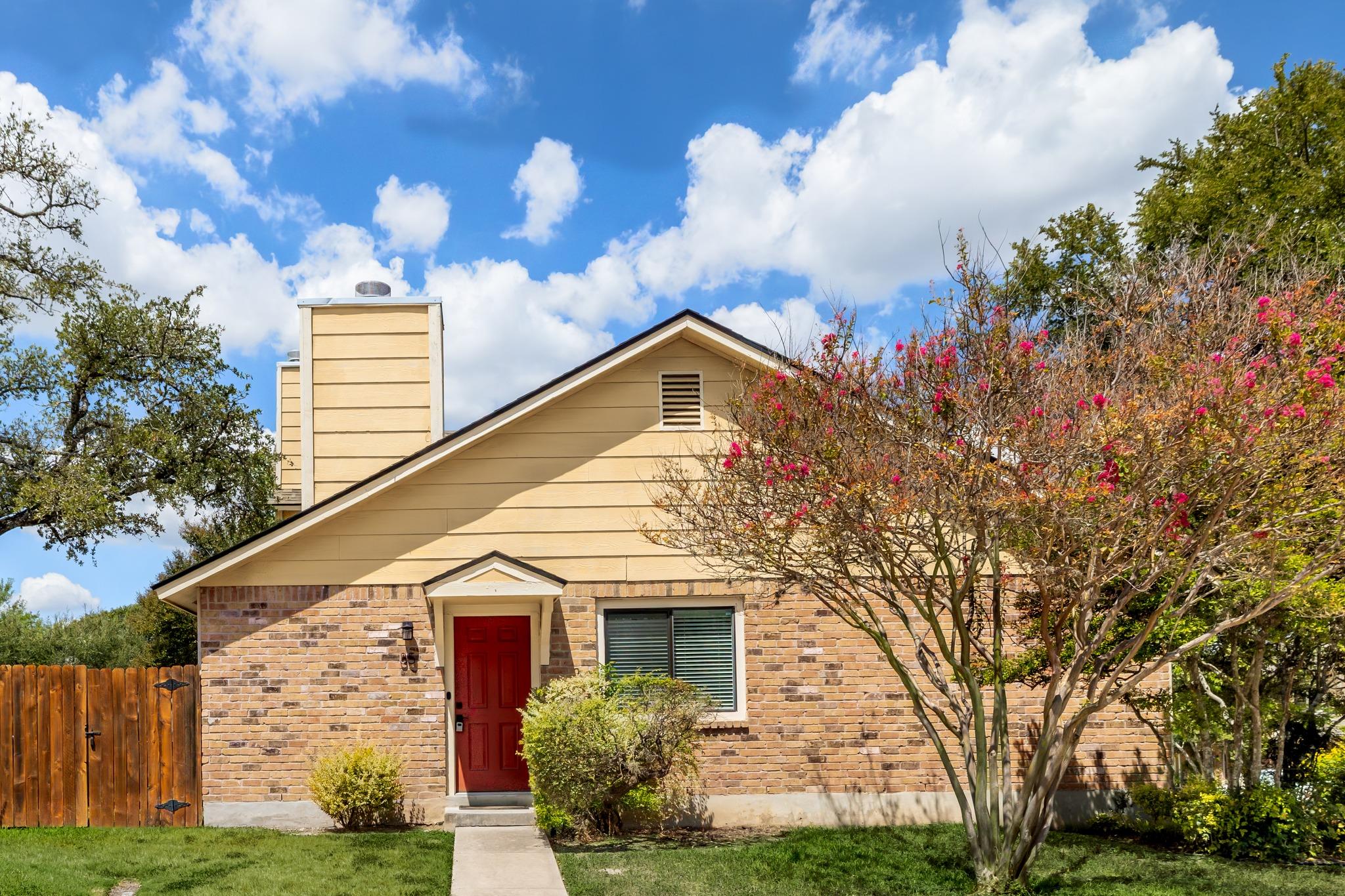 Warm brick and classic siding frame a welcoming e