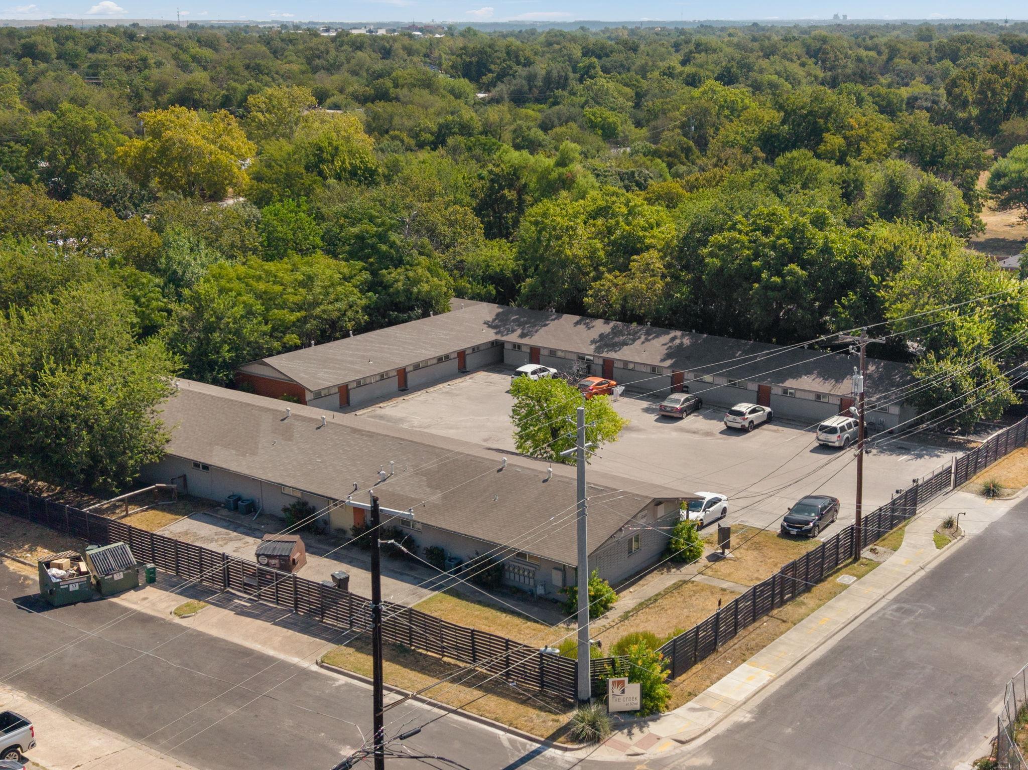 Mature trees frame this single-level residential 