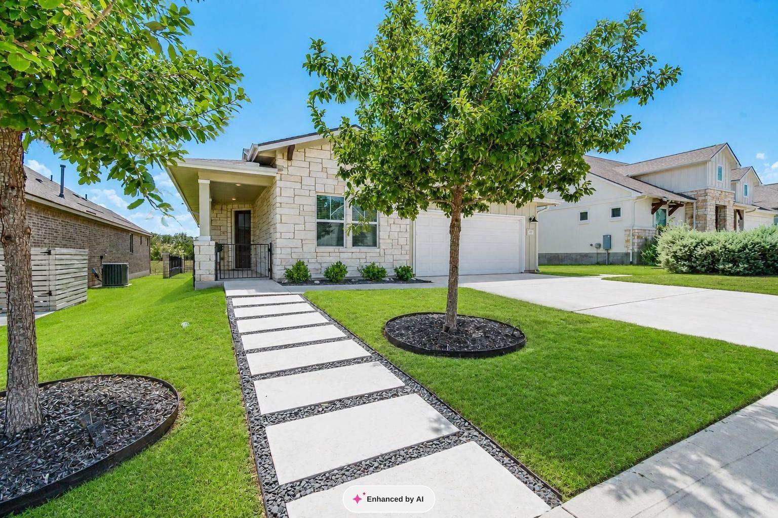 A modern stone facade and custom stepping stone p